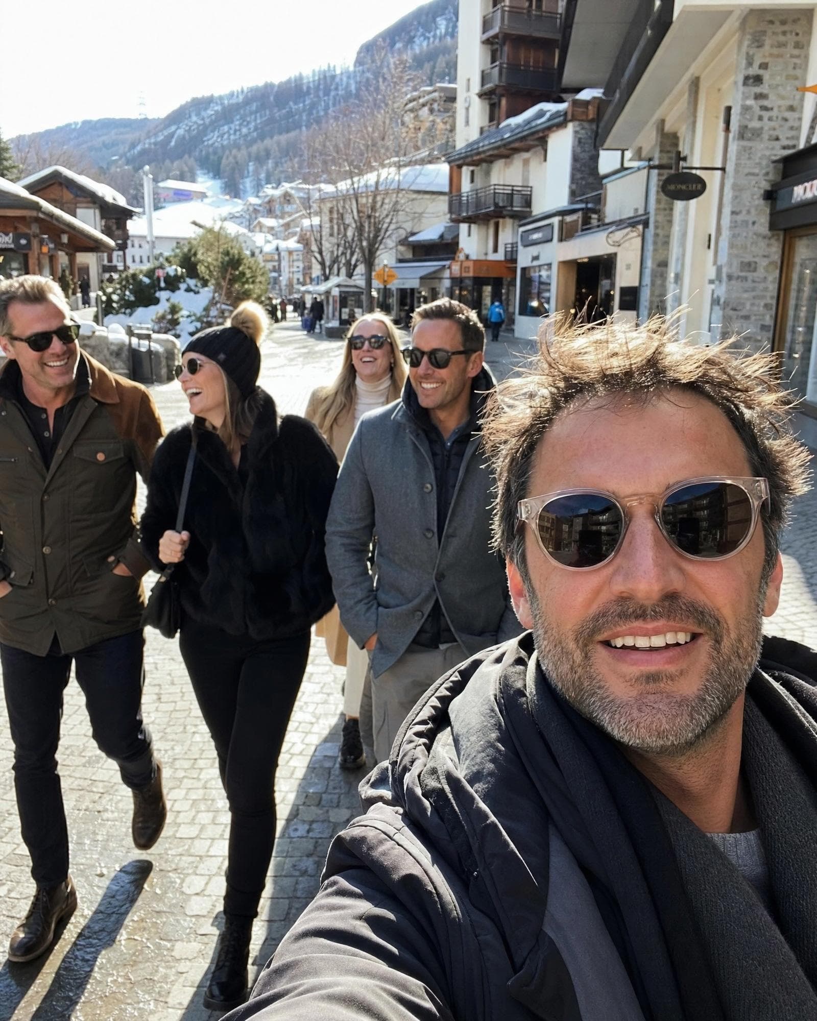 FATFIRE members taking a selfie in a snowy alpine ski village